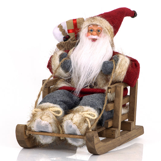 BABBO NATALE NOEL BABA SEDUTO NELLA SLITTA 30Cm